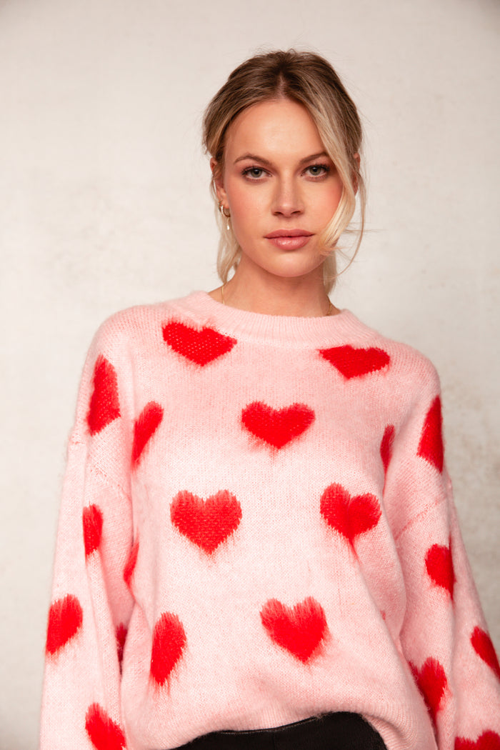 fuzzy pink and red heart jumper